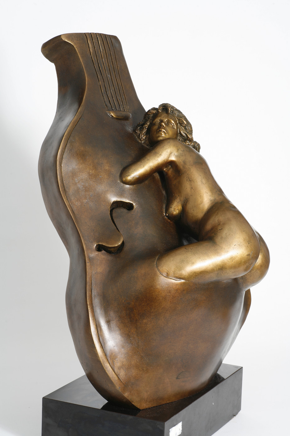 Bronze Aria — a golden bronze female figure merged with the body of a cello